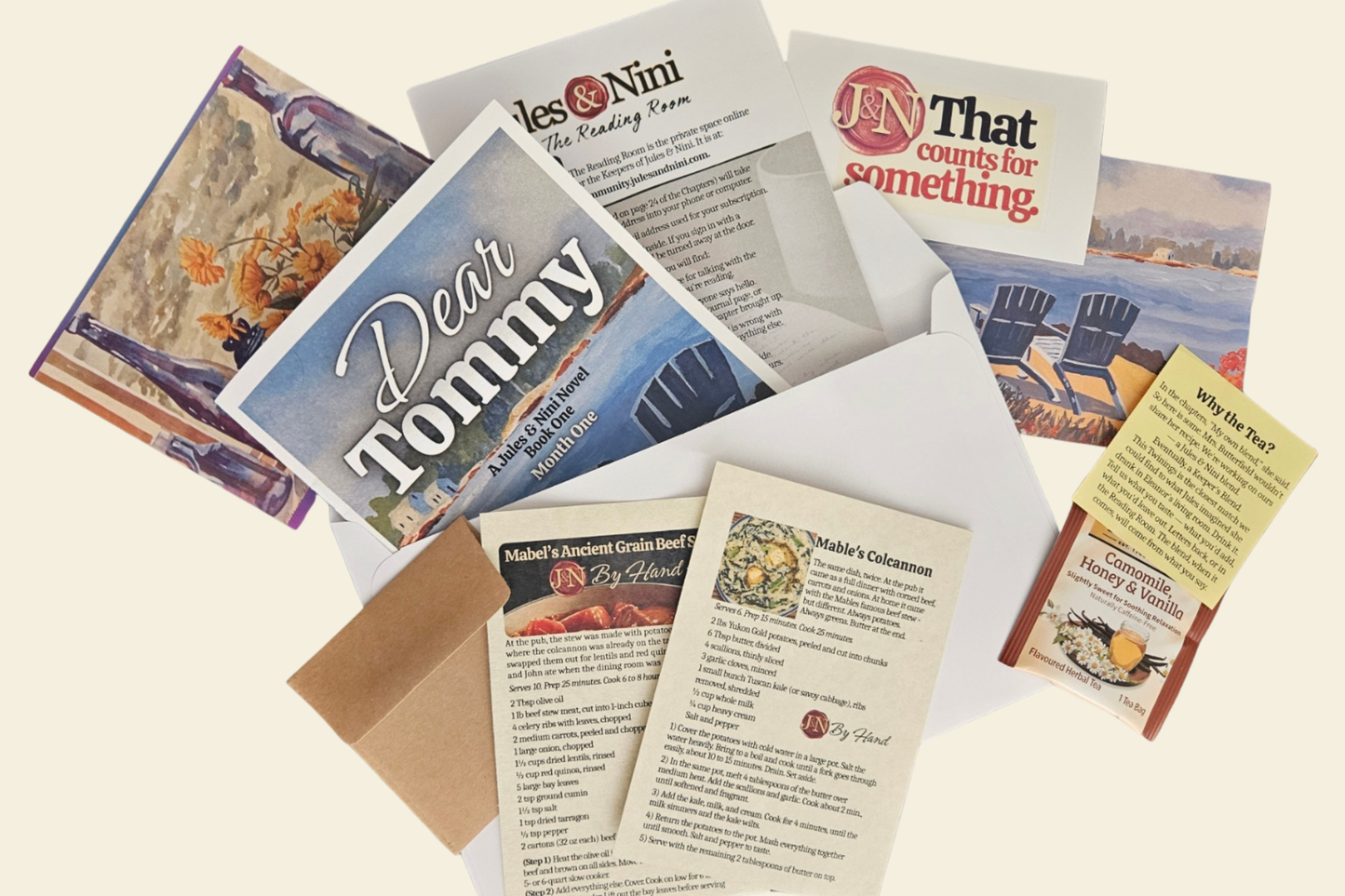 Jules & Nini parcel — chapters of a real novel, a personal letter, postcards, recipe cards, and art prints, mailed from Cumberland, Maine